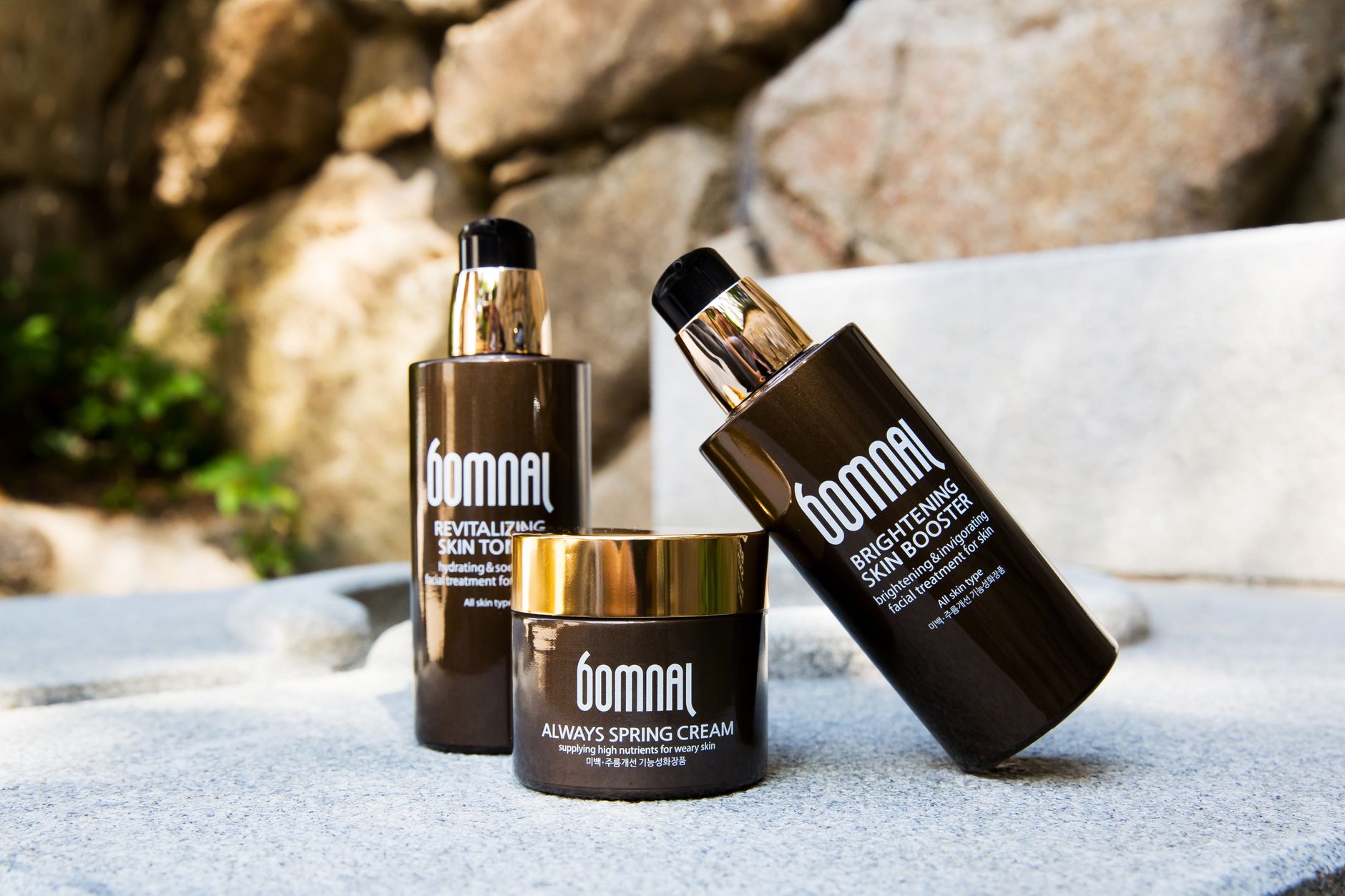 Amber skincare bottles typical of Korean serum and moisturizer packaging.