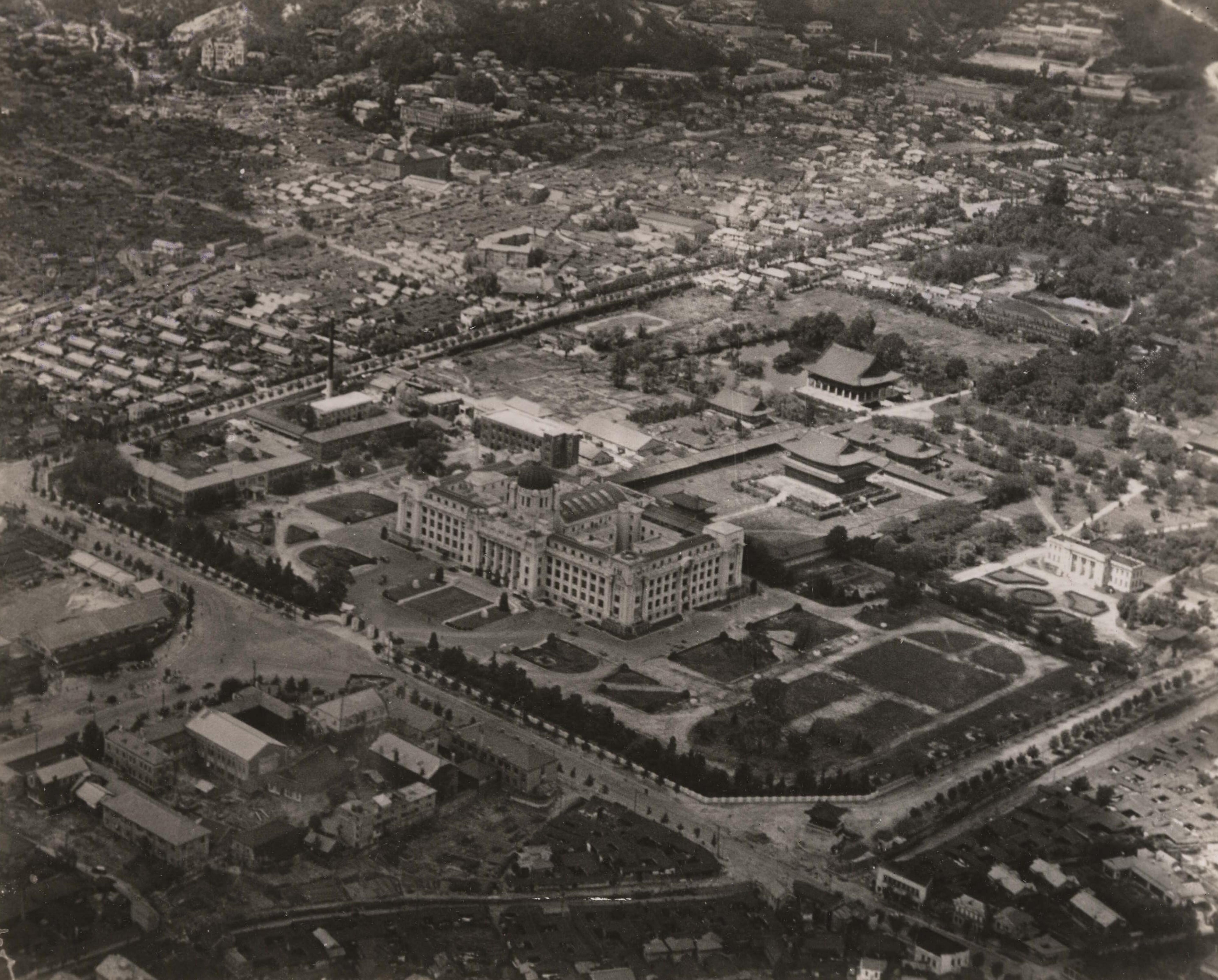 An aerial shot of Seoul just weeks after its liberation from Japan. The Government-General Building is visible, along with Gyeongbokgung.