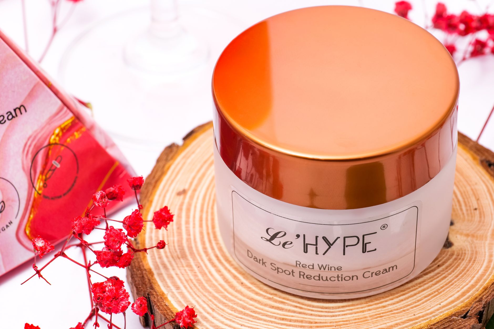Le'Hype Red Wine Dark Spot Reduction Cream in an elegant skincare product photo.
