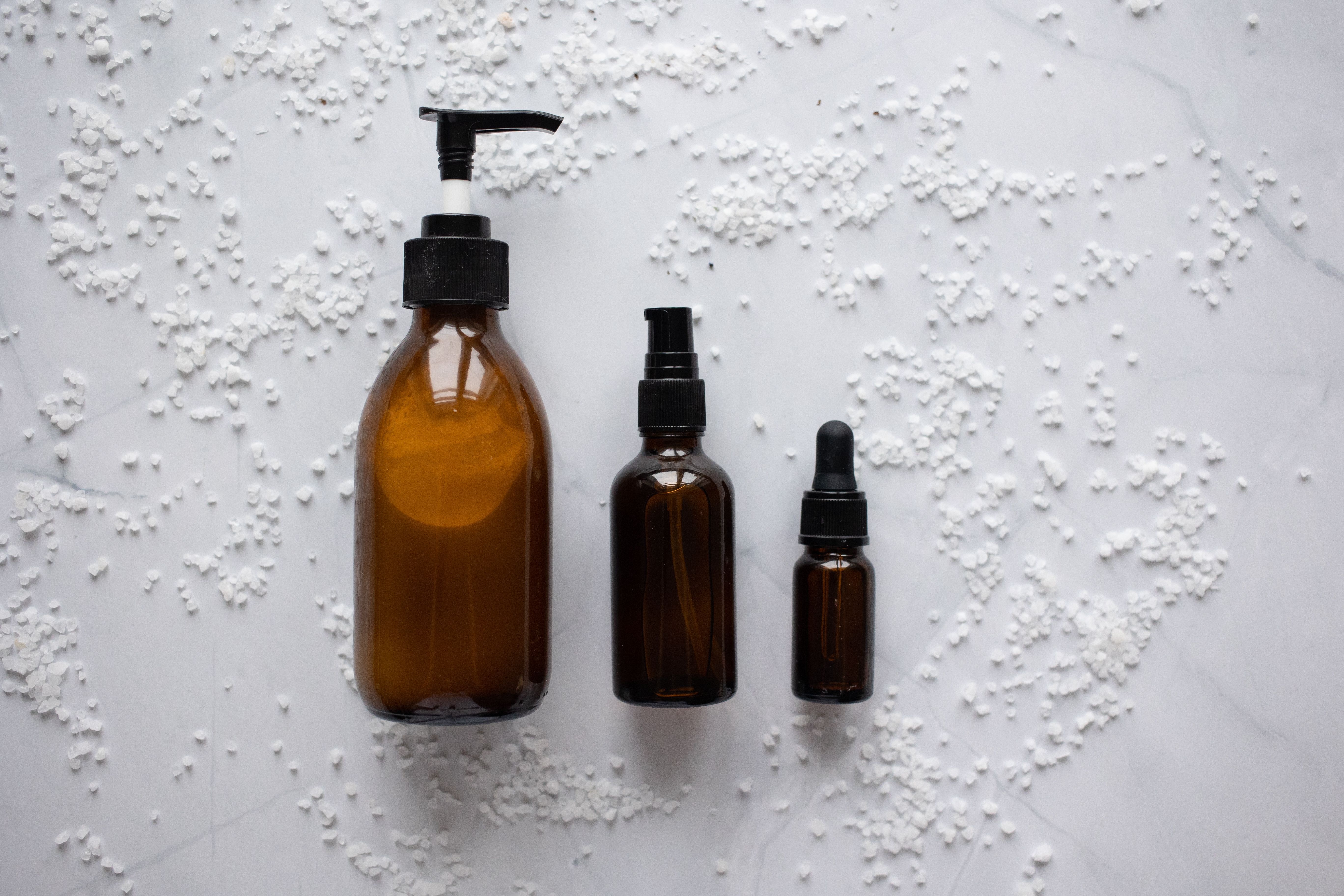 Minimal Korean skincare bottles and dropper — K-beauty reference photo