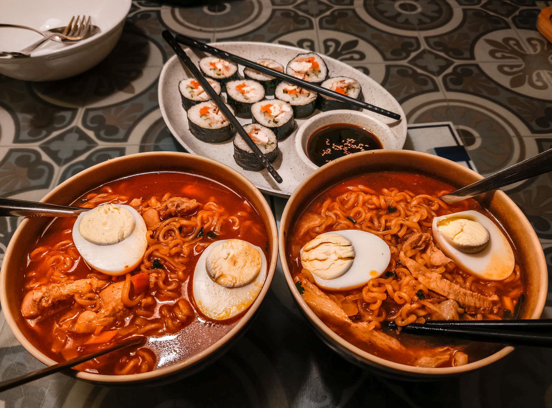 Enjoy a sumptuous bowl of ramen with eggs and sushi served in Darjeeling's unique ambiance.