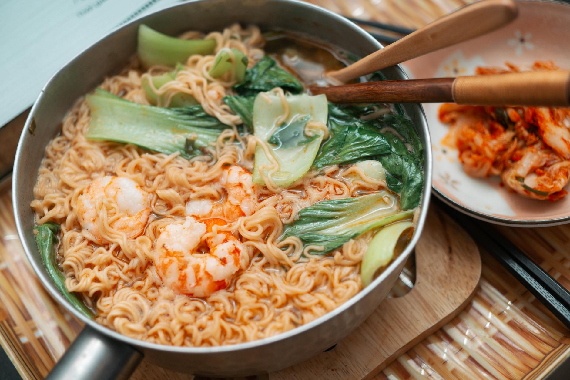 Mouthwatering shrimp ramen with fresh bok choy, served with spicy kimchi. Perfect Asian comfort food.