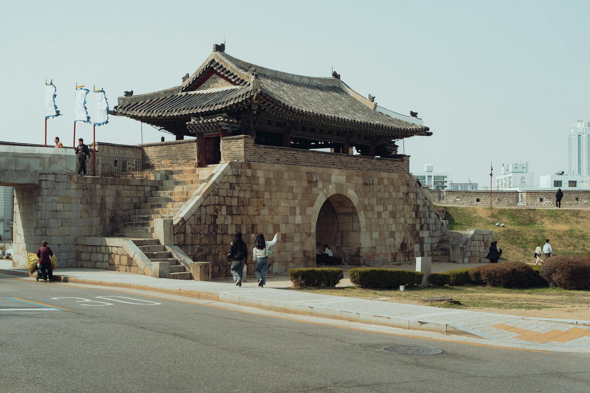 Explore the ancient Hwaseong Fortress gate in Suwon, Korea, showcasing traditional architecture.